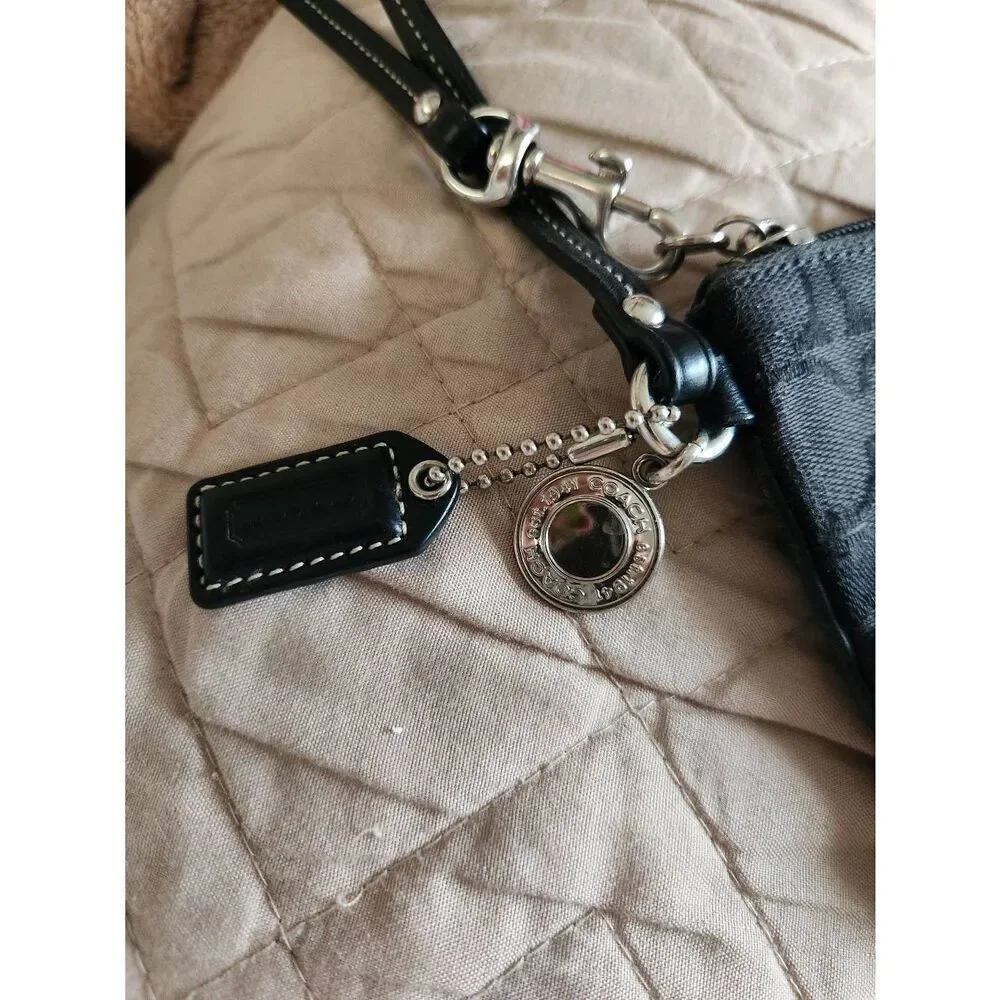 Coach black Signature Jacquard small Zip Wristlet with 65th anniversary lining